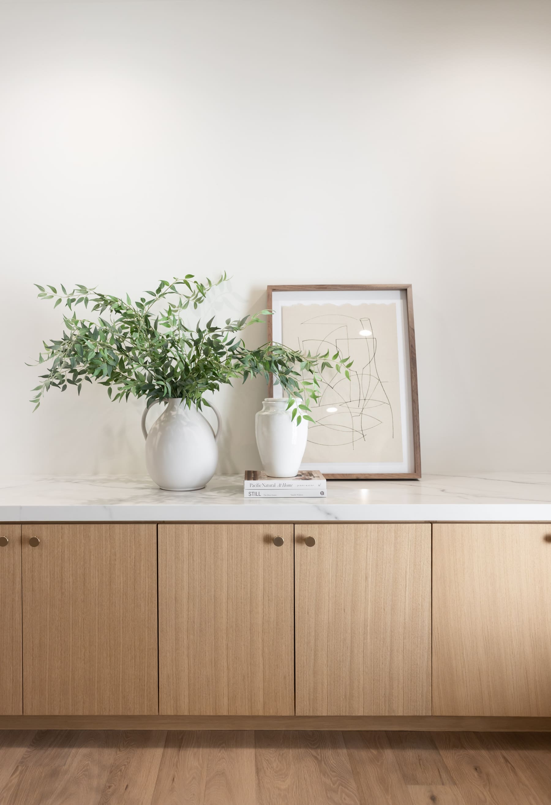 White oak flat-panel sideboard built-in with marble top — Phoenix custom cabinetry